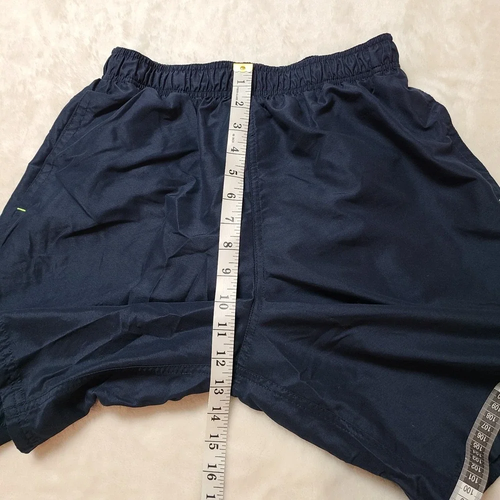 VTG NIKE gym Shorts Medium Mesh Lining Swim Trunks Swoosh Logo Pockets